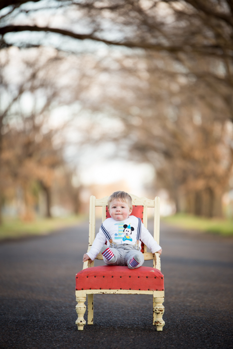 1st birthday photo shoot, king george avenue tamworth nsw- baby on red chair